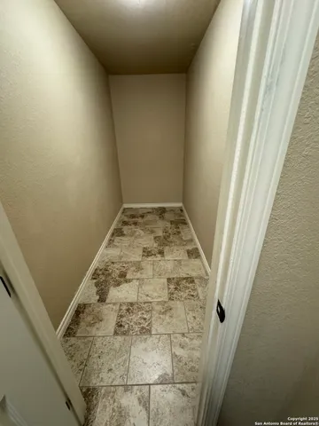 a view of a yard with large trees