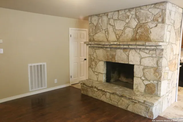a living room with a fireplace