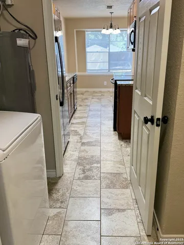 a bathroom with a granite countertop shower a sink and a mirror