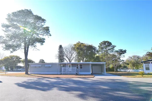 a view of an outdoor space and basketball court