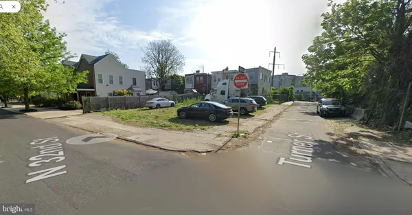 a view of street with parked cars