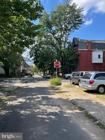 a view of a street with trees on both side