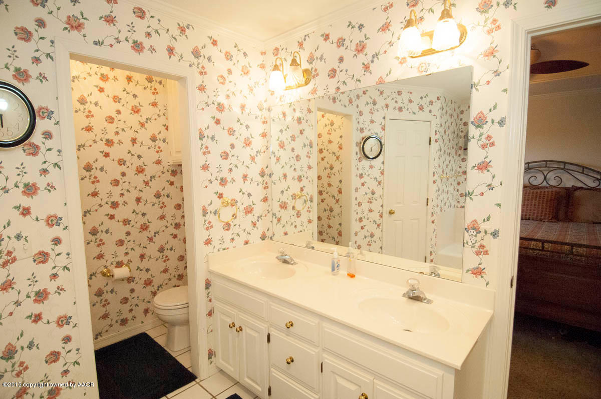 5402 Leo Lane Amarillo, TX 79110 - Photo 21 of 37 a bathroom with a sink and a bathtub