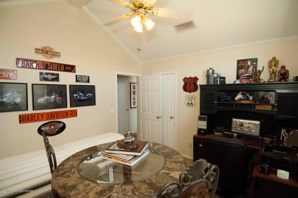 5402 Leo Lane Amarillo, TX 79110 - Photo 23 of 37 a bedroom with bed and furniture