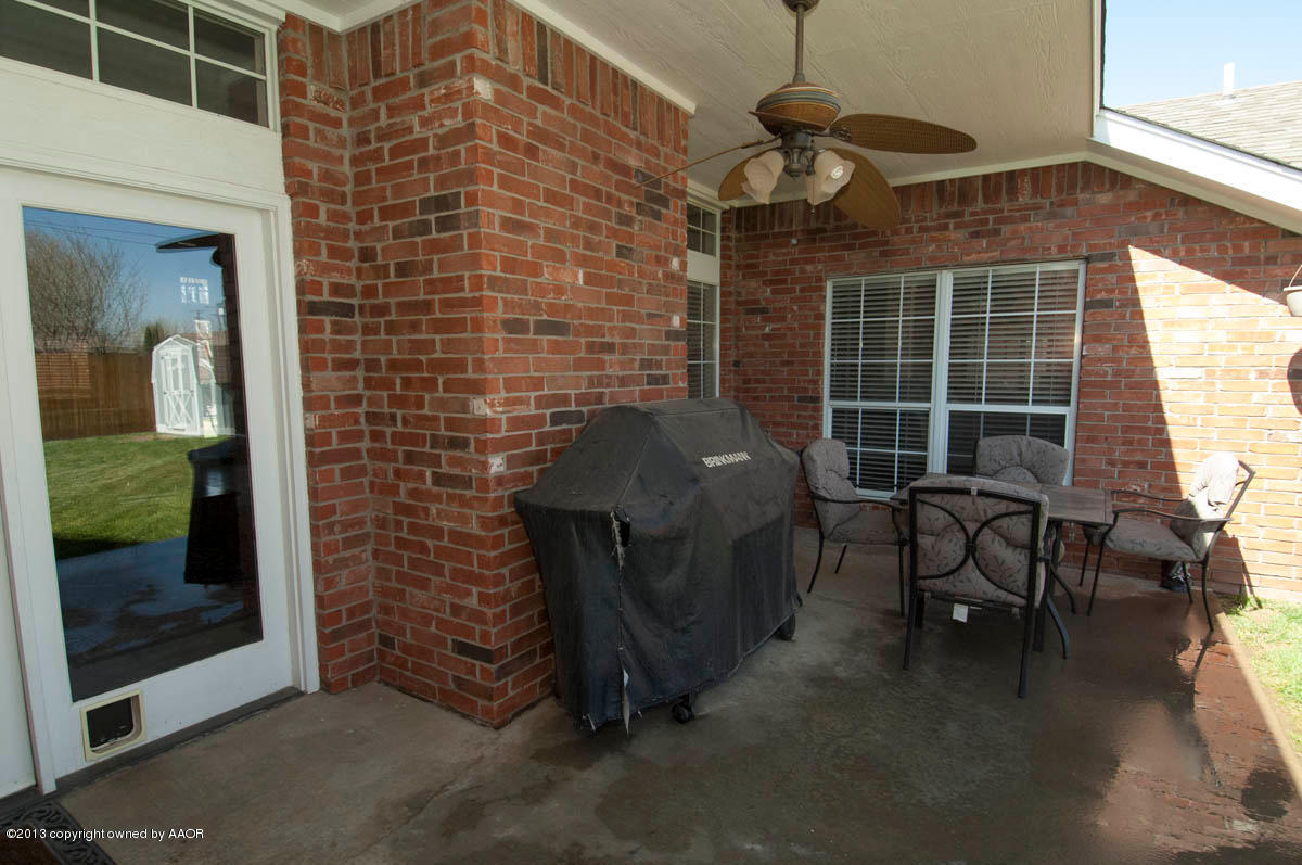 5402 Leo Lane Amarillo, TX 79110 - Photo 31 of 37 a brick building with a bench in front of it