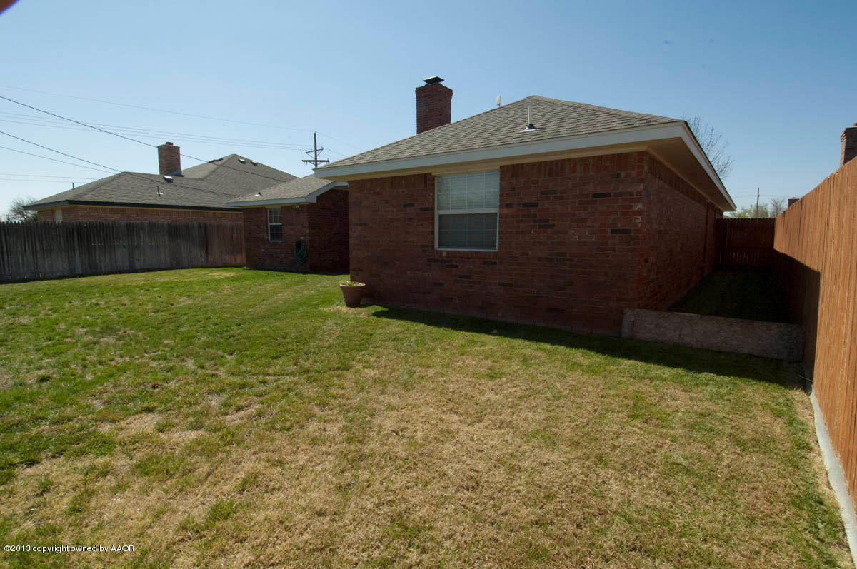 5402 Leo Lane Amarillo, TX 79110 - Photo 32 of 37 a front view of a house with garden