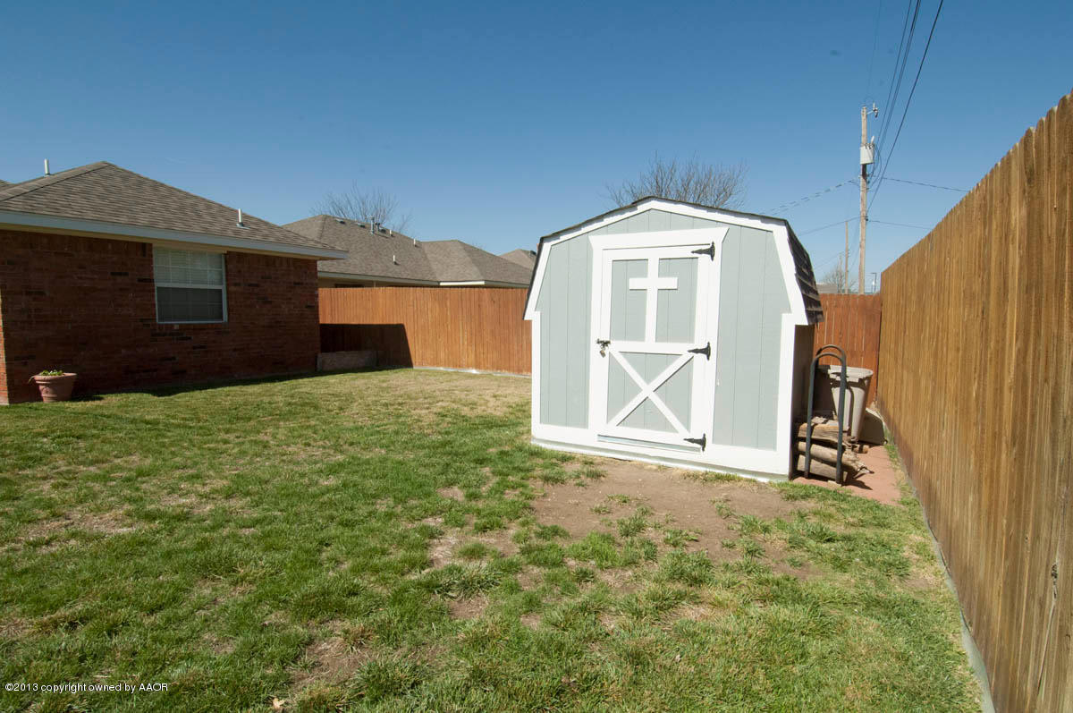 5402 Leo Lane Amarillo, TX 79110 - Photo 33 of 37 a view of a small house with a yard