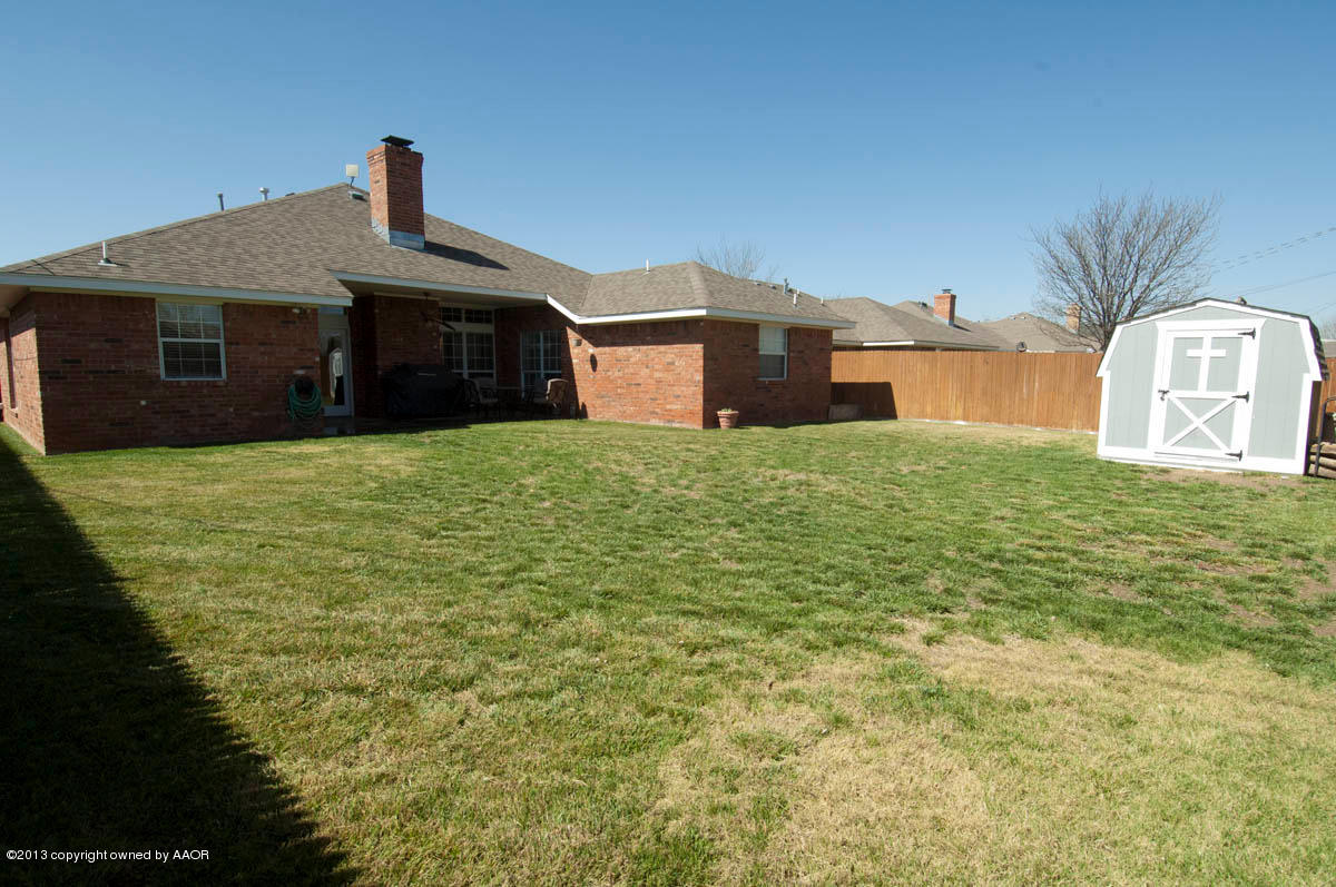 5402 Leo Lane Amarillo, TX 79110 - Photo 35 of 37 a front door view of a house with garden