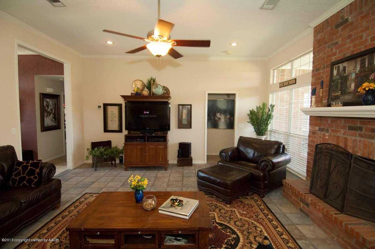 5402 Leo Lane Amarillo, TX 79110 - Photo 7 of 37 a living room with furniture and a fireplace