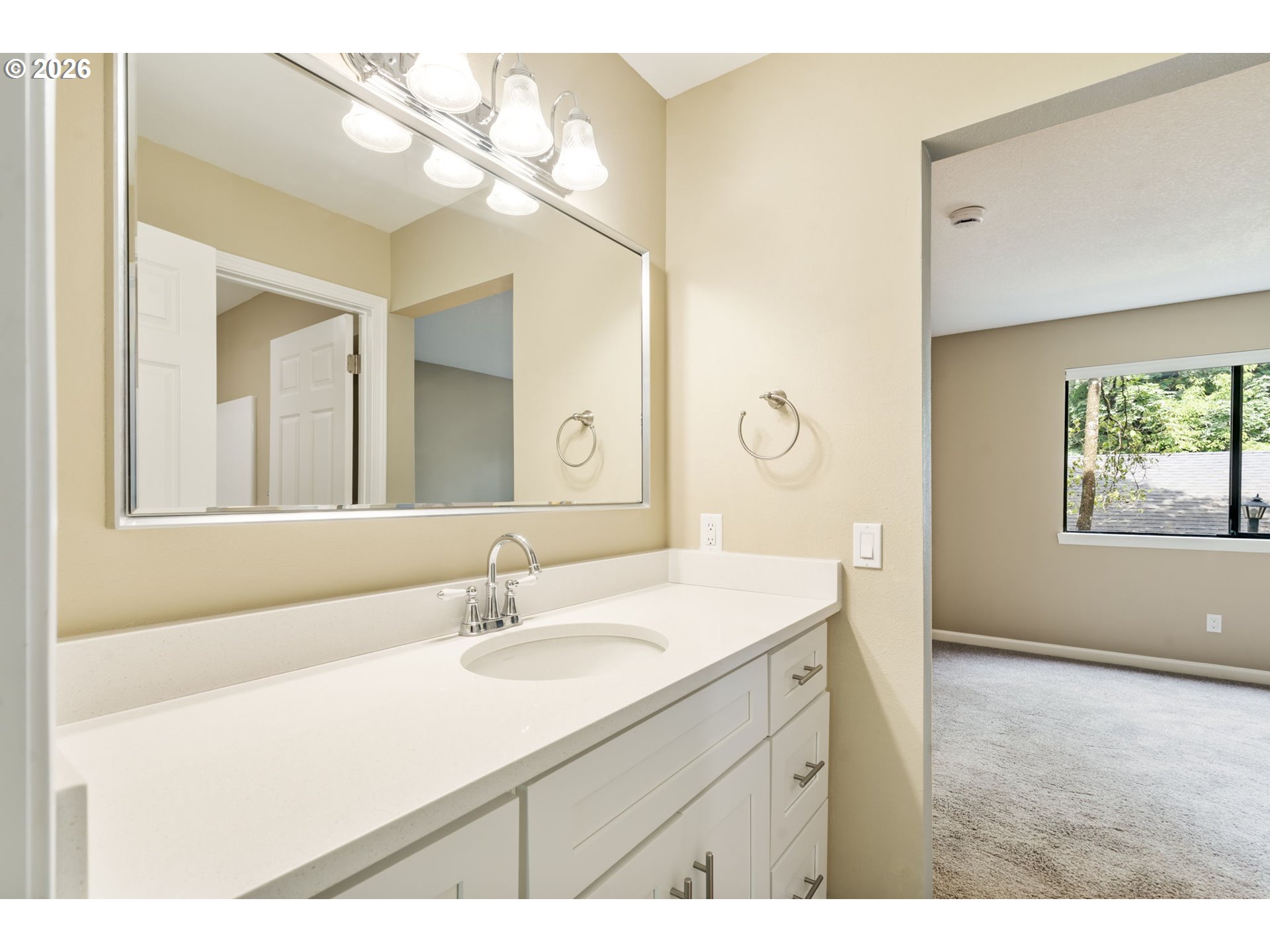 9967 Southeast Talbert Street Clackamas, OR 97015 - Photo 24 of 33 a bathroom with a sink vanity granite and a mirror