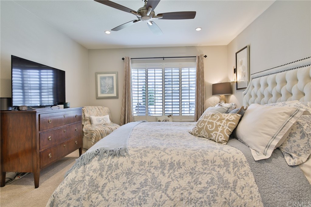 38 Racing Wind Irvine, CA 92614 - Photo 17 of 56 a bedroom with a large bed and a window