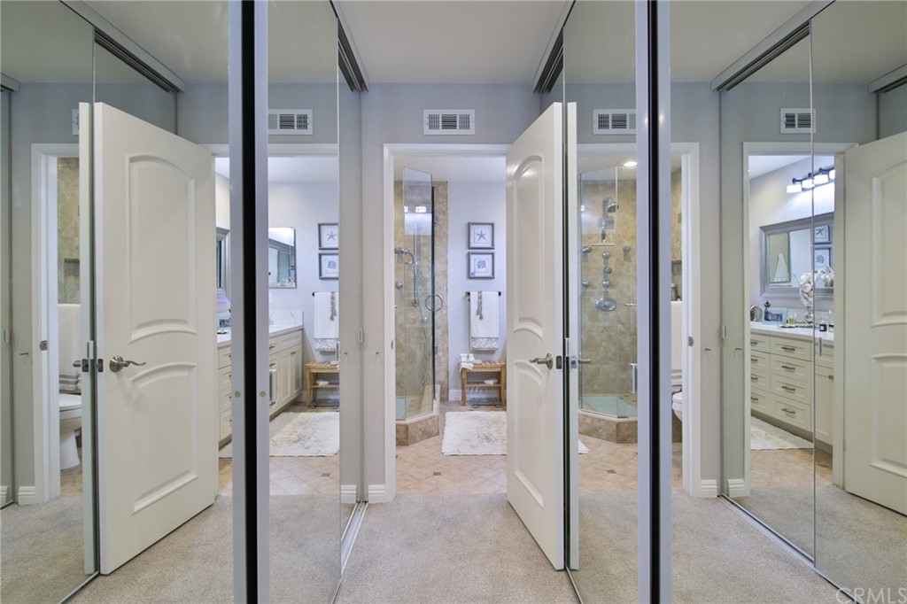 38 Racing Wind Irvine, CA 92614 - Photo 19 of 56 a bathroom with a glass shower door and a glass door