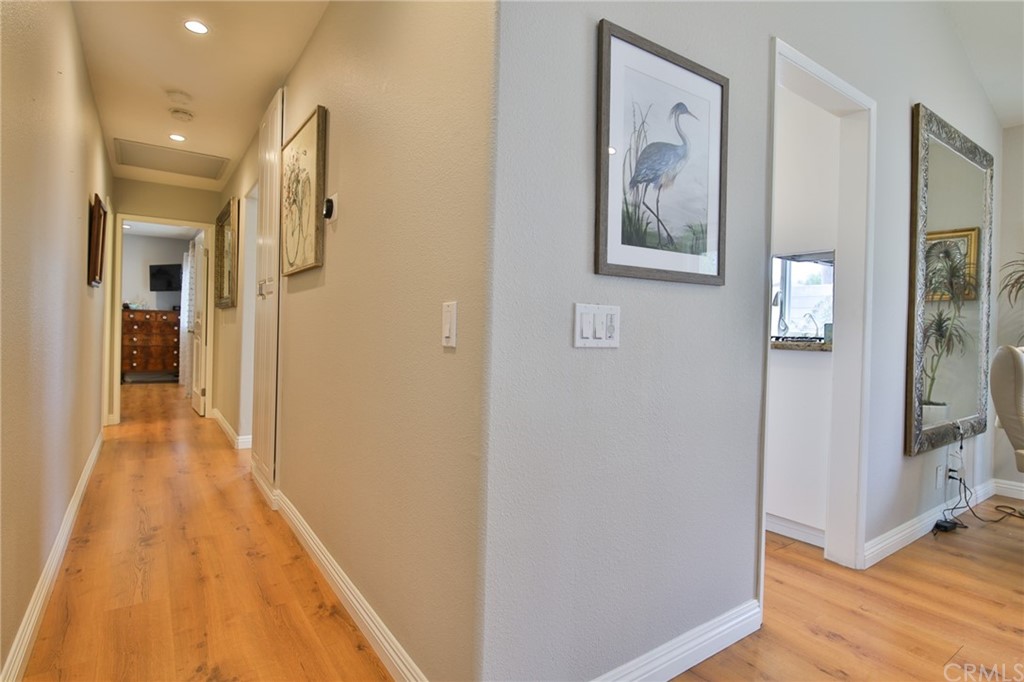 38 Racing Wind Irvine, CA 92614 - Photo 23 of 56 a view of a hallway with wooden floor and staircase
