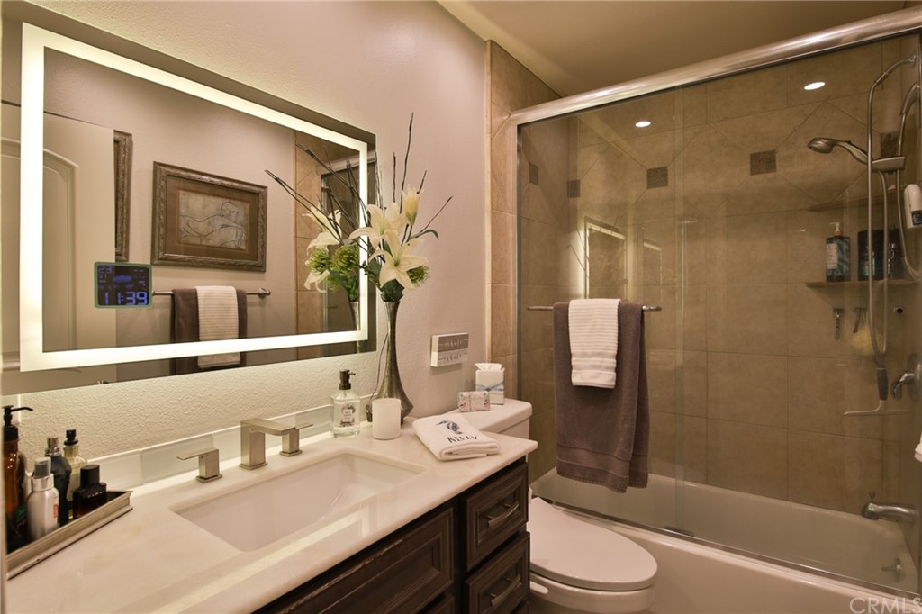 38 Racing Wind Irvine, CA 92614 - Photo 28 of 56 a bathroom with a sink a toilet and shower