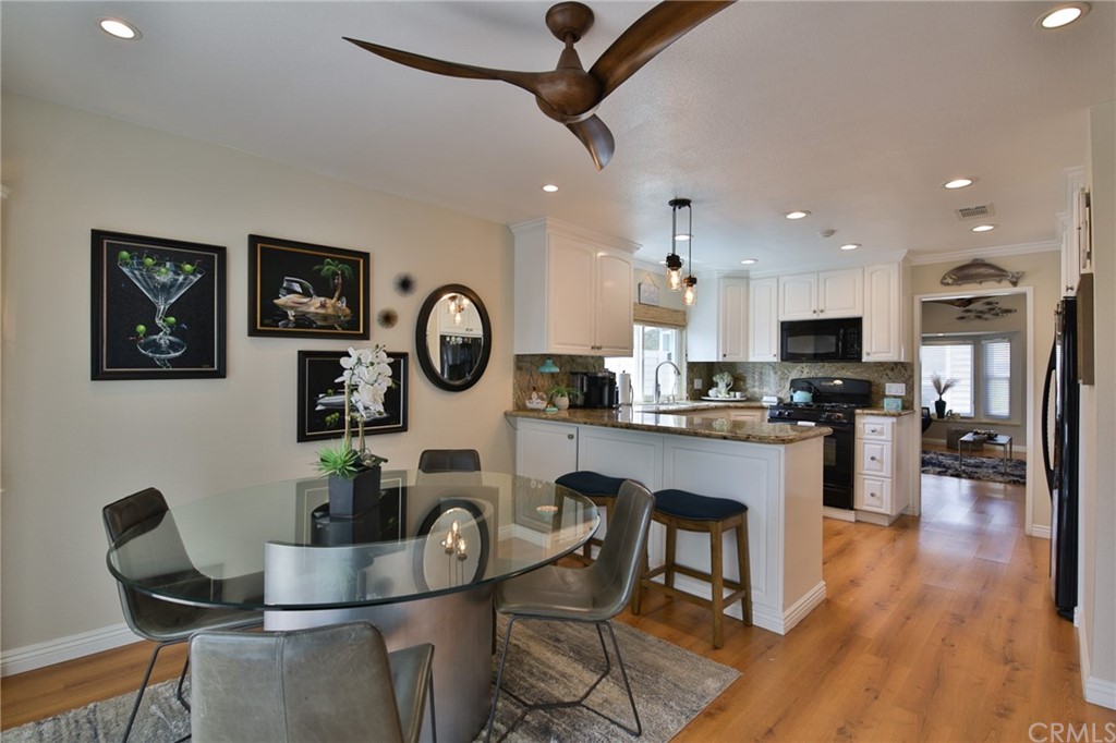 38 Racing Wind Irvine, CA 92614 - Photo 31 of 56 a living room with kitchen furniture and a wooden floor