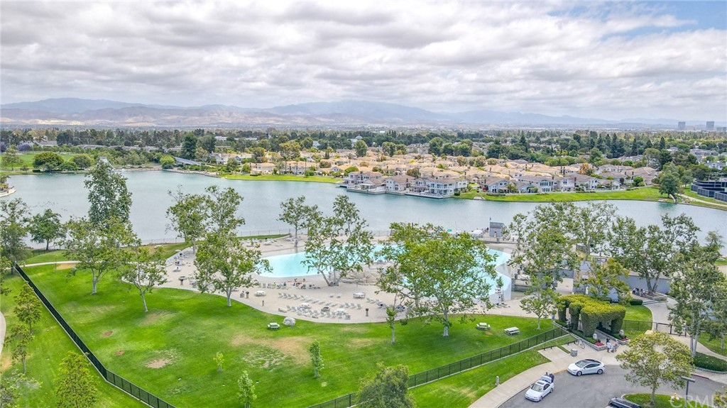 38 Racing Wind Irvine, CA 92614 - Photo 54 of 56 a view of a lake with houses in the back