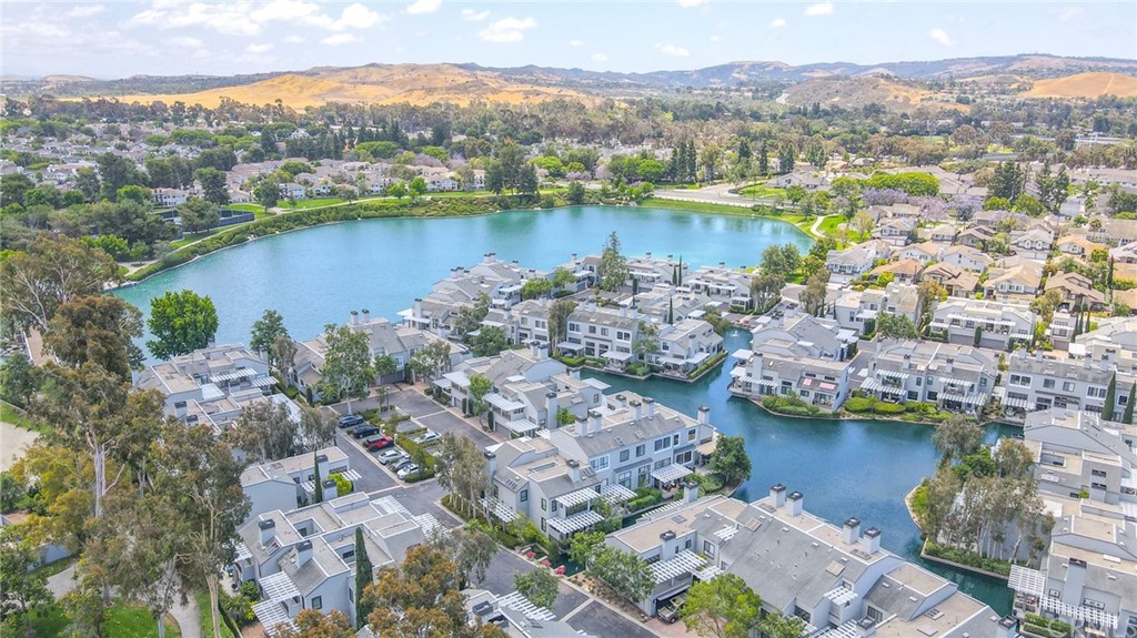 38 Racing Wind Irvine, CA 92614 - Photo 55 of 56 an aerial view of city and lake with trees all around