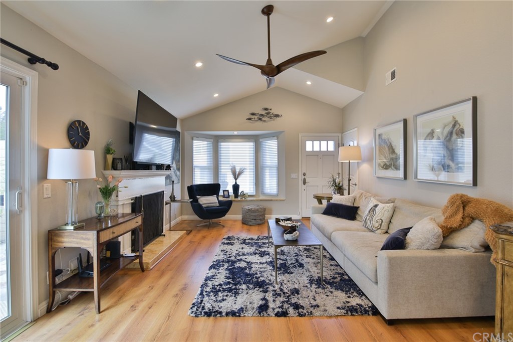 38 Racing Wind Irvine, CA 92614 - Photo 8 of 56 a living room with furniture fireplace and a flat screen tv