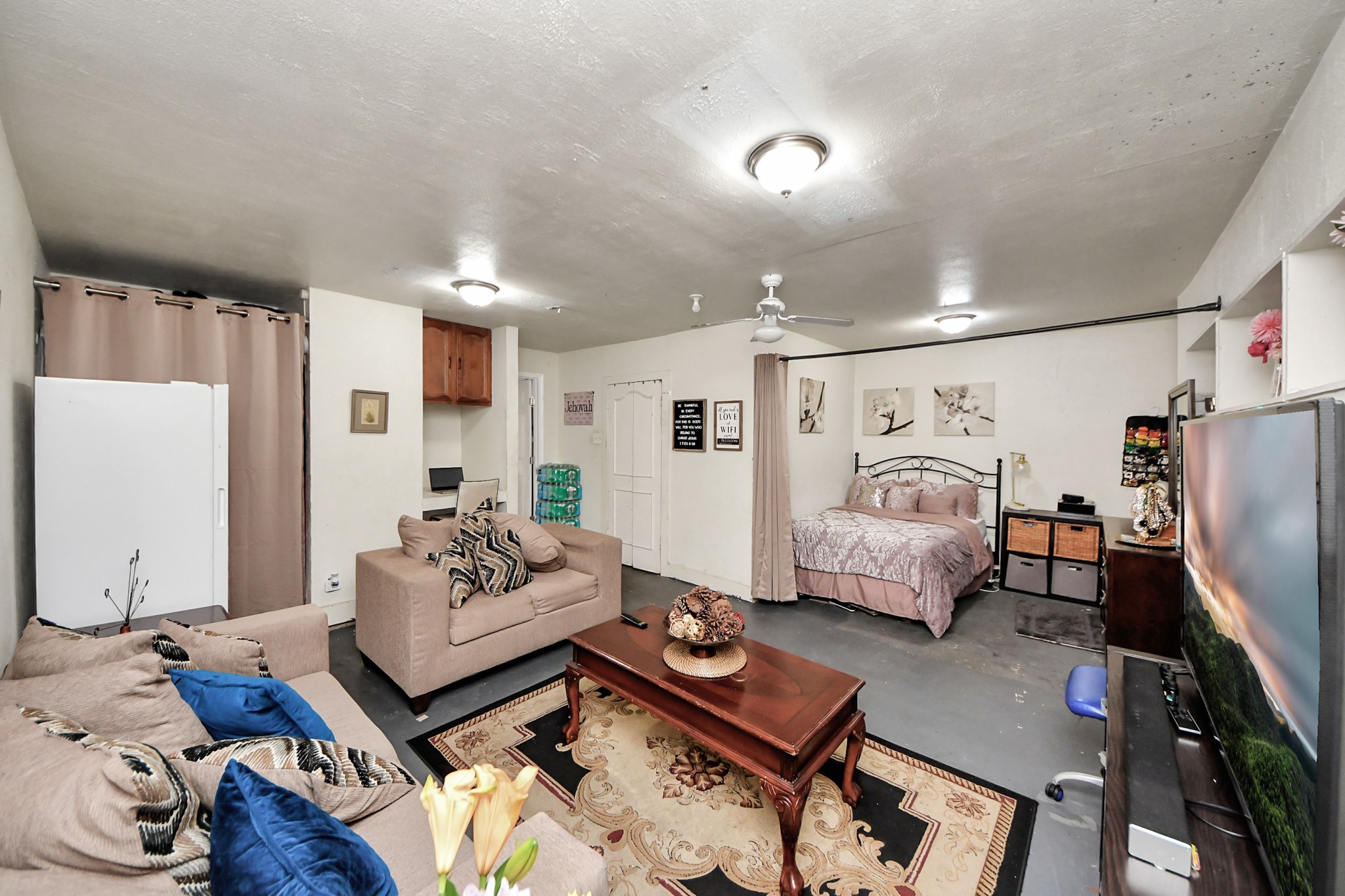 4155 Amir Street Houston, TX 77072 - Photo 27 of 43 a living room with furniture and a flat screen tv
