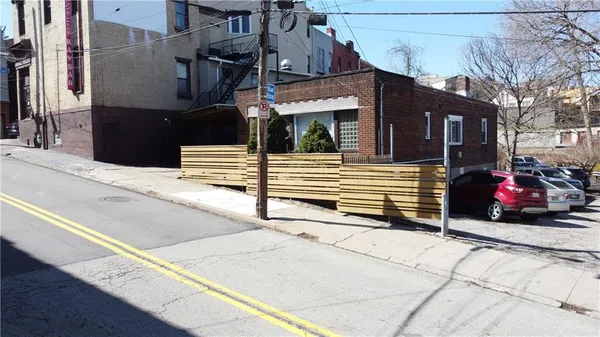 a view of a house with a parking space