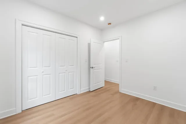 a bathroom with a sink vanity mirror and toilet