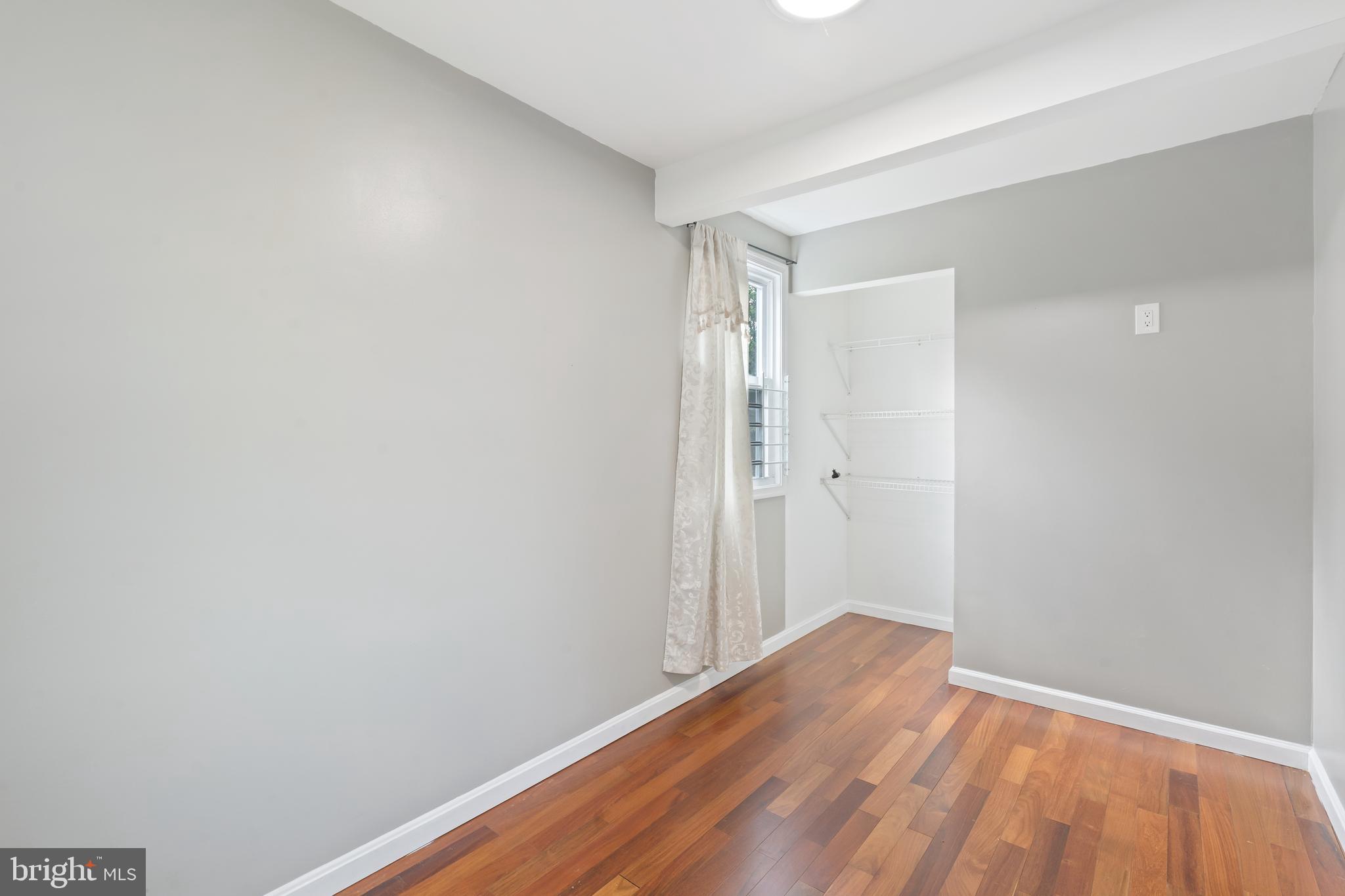 4400 6th Street Baltimore, MD 21225 - Photo 17 of 45 a view of an empty room with wooden floor