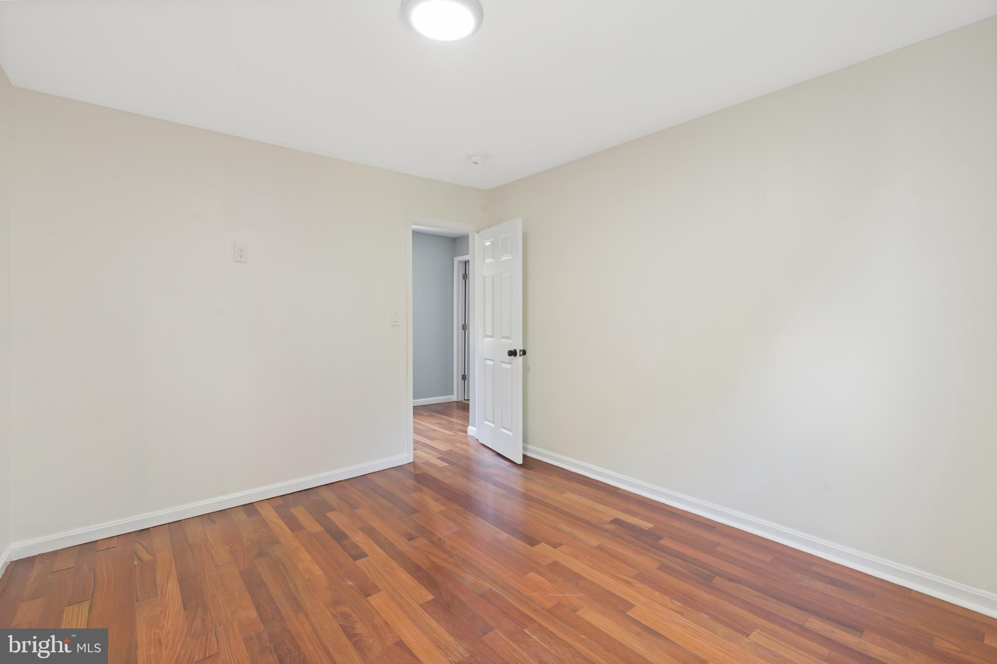 4400 6th Street Baltimore, MD 21225 - Photo 22 of 45 a view of an empty room with wooden floor