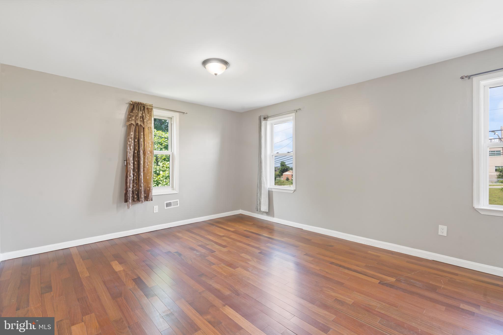 4400 6th Street Baltimore, MD 21225 - Photo 23 of 45 an empty room with windows and natural light
