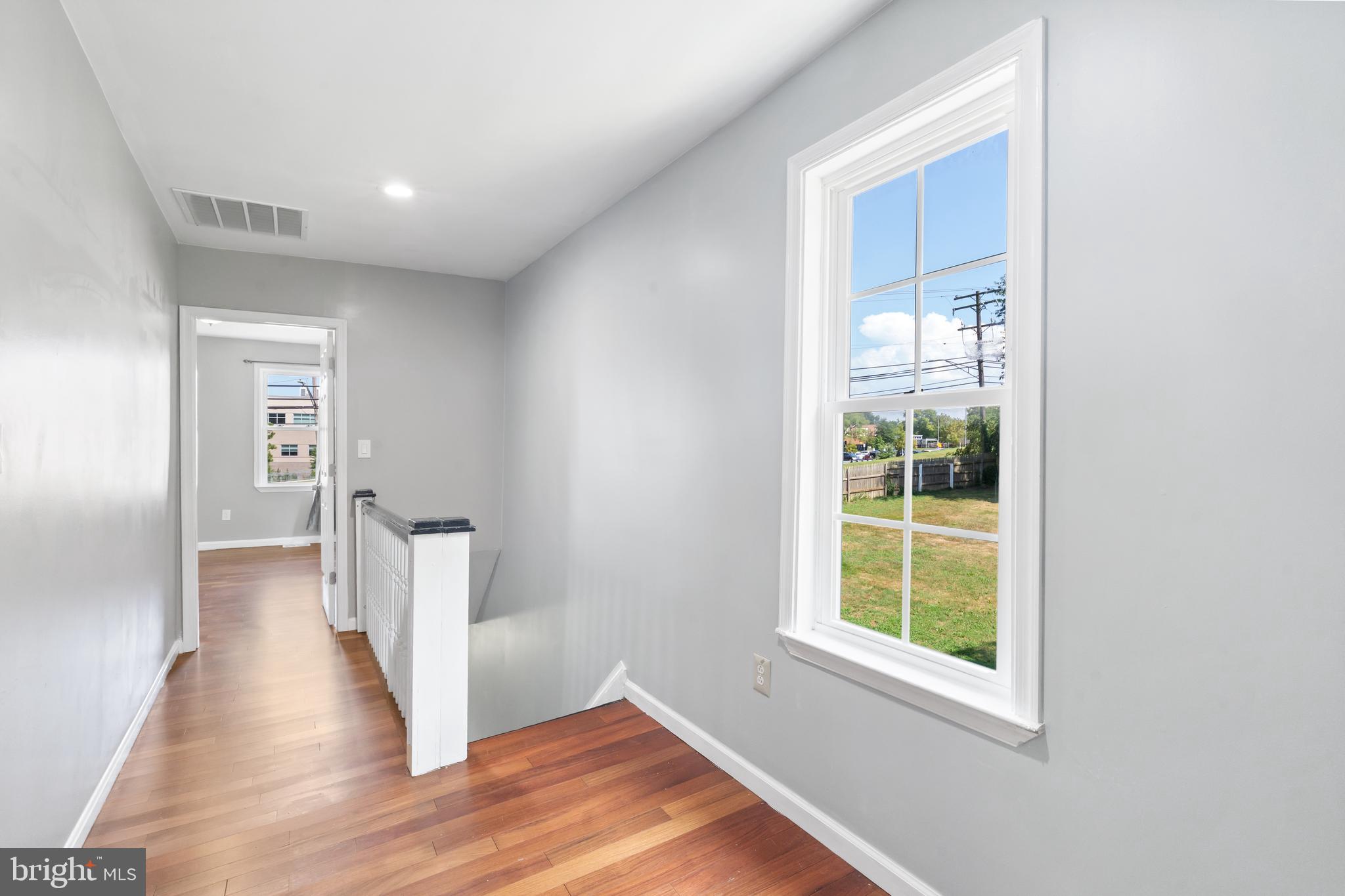 4400 6th Street Baltimore, MD 21225 - Photo 25 of 45 wooden floor in an empty room with a window