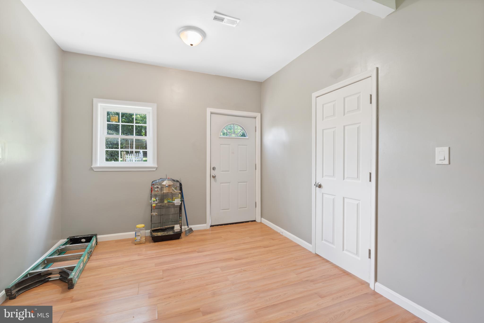 4400 6th Street Baltimore, MD 21225 - Photo 30 of 45 a room with a bed and wooden floor