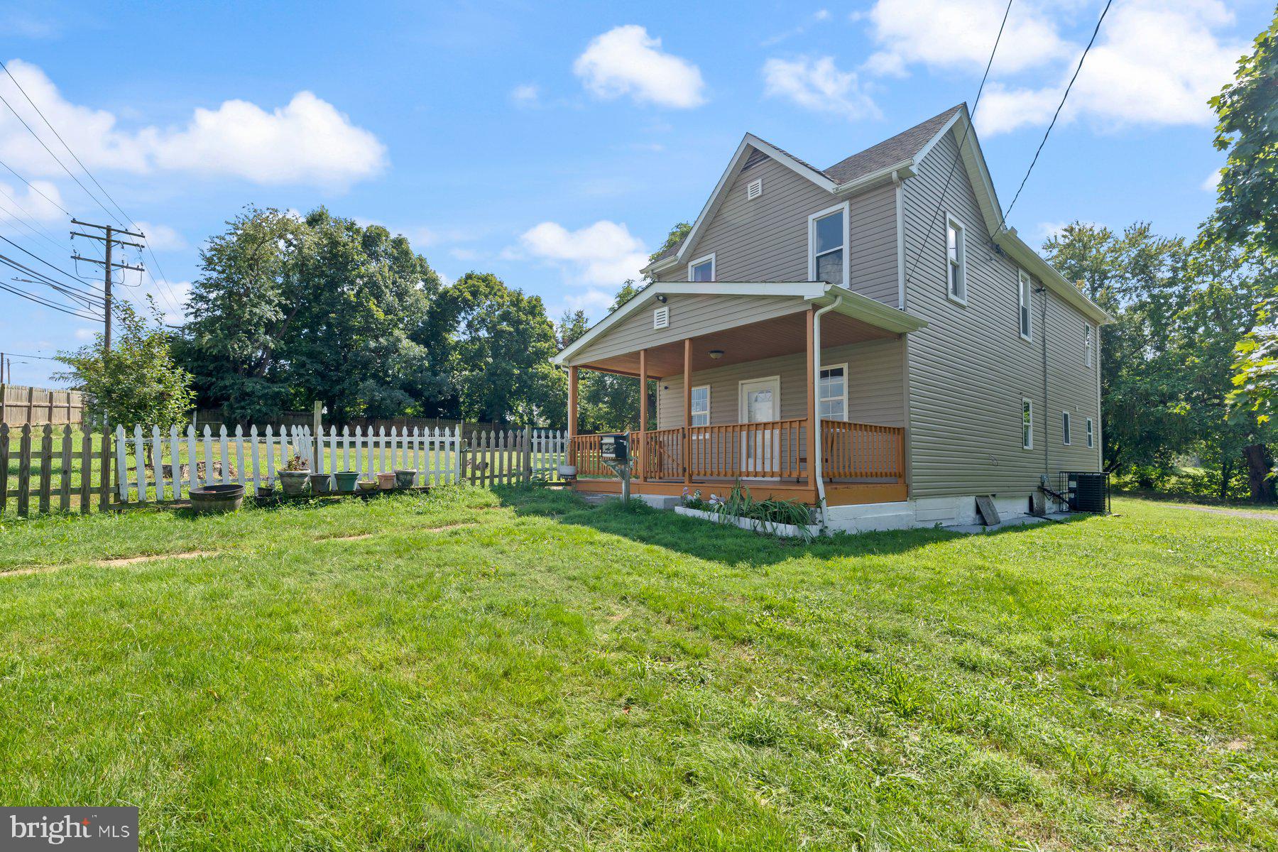 4400 6th Street Baltimore, MD 21225 - Photo 3 of 45 a view of a house with a yard and sitting area