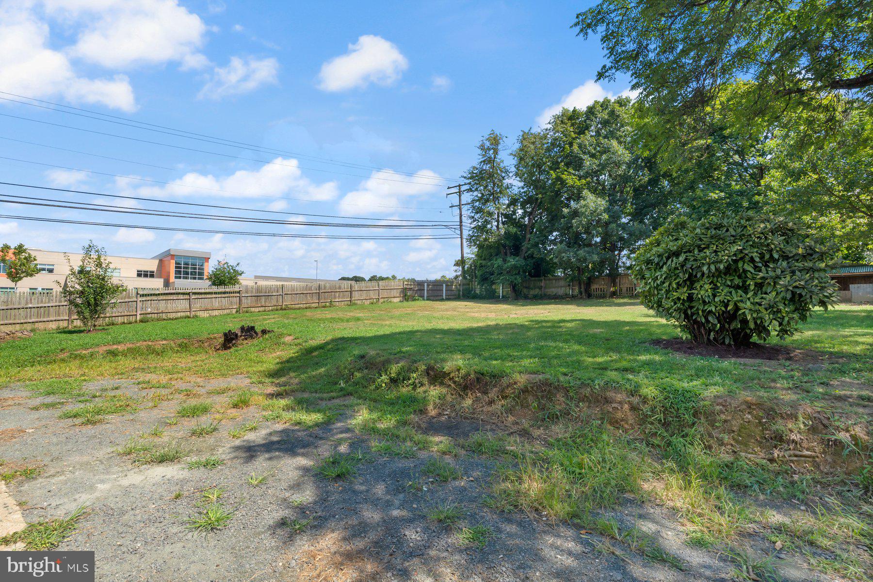 4400 6th Street Baltimore, MD 21225 - Photo 39 of 45 a backyard of a house with lots of green space and garden