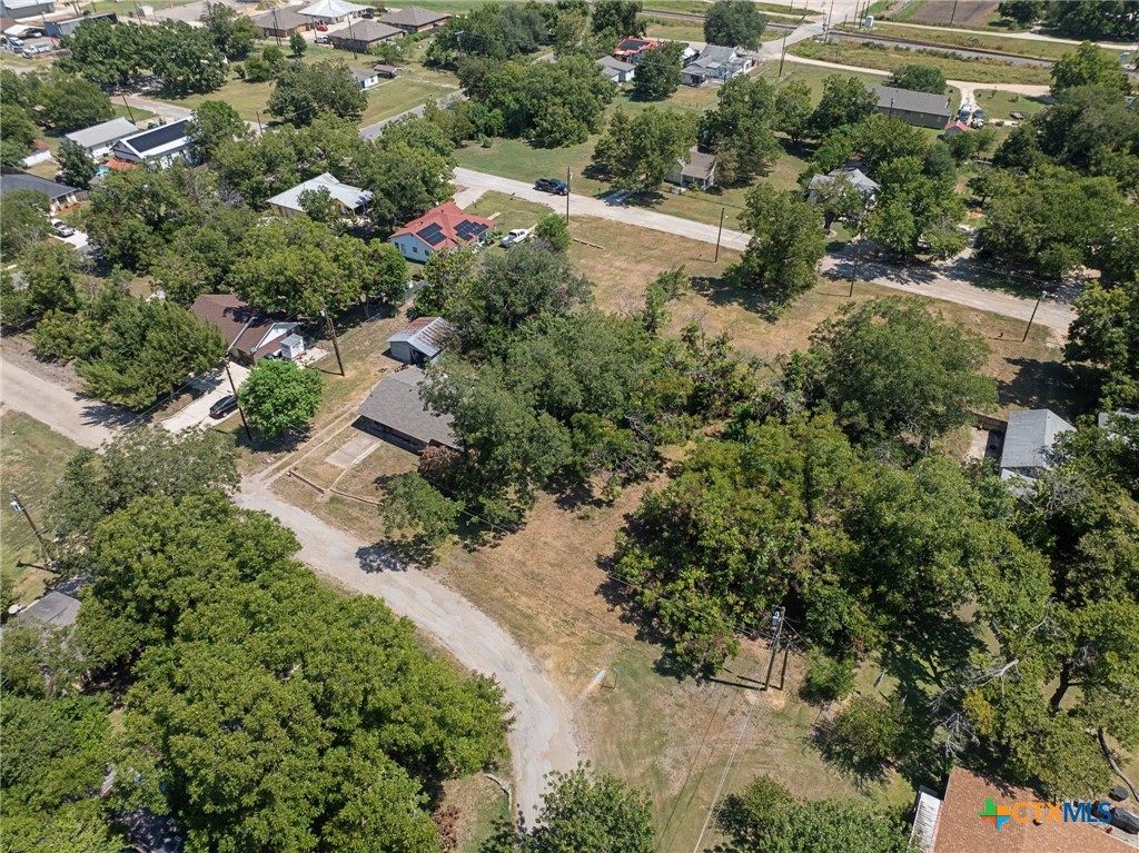 305 South Austin Street Holland, TX 76534 - Photo 12 of 14 an aerial view of residential house with outdoor space and trees all around