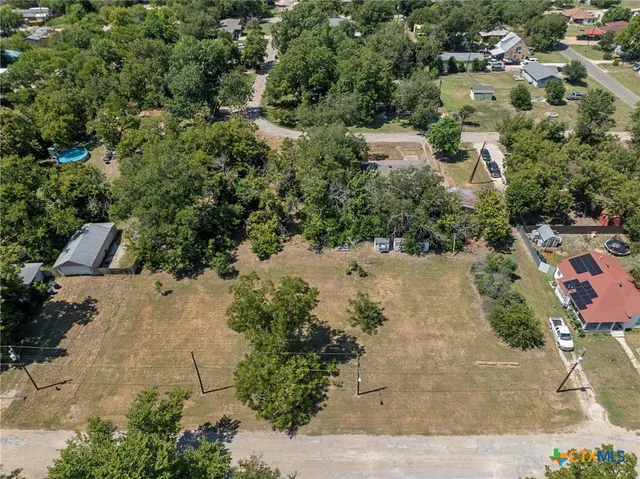an aerial view of residential house with outdoor space