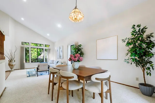 a dining room with furniture and window
