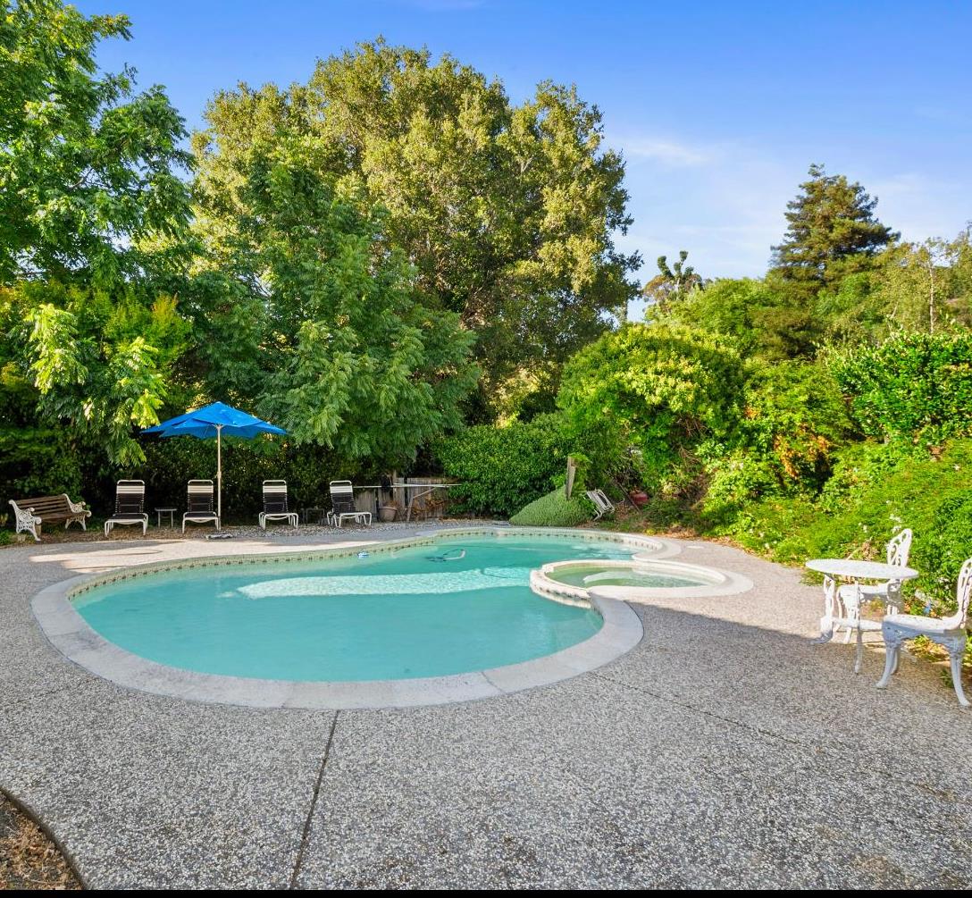 615 Stanley Lane El Sobrante, CA 94803 - Photo 2 of 39 a view of a swimming pool with a yard