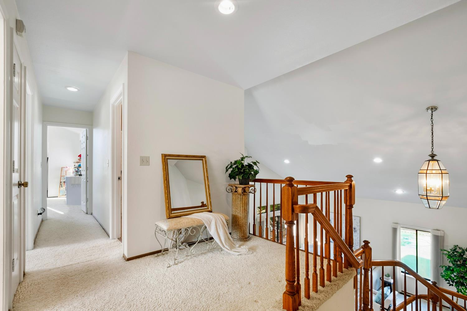 615 Stanley Lane El Sobrante, CA 94803 - Photo 21 of 39 a view of a hallway with windows and stairs
