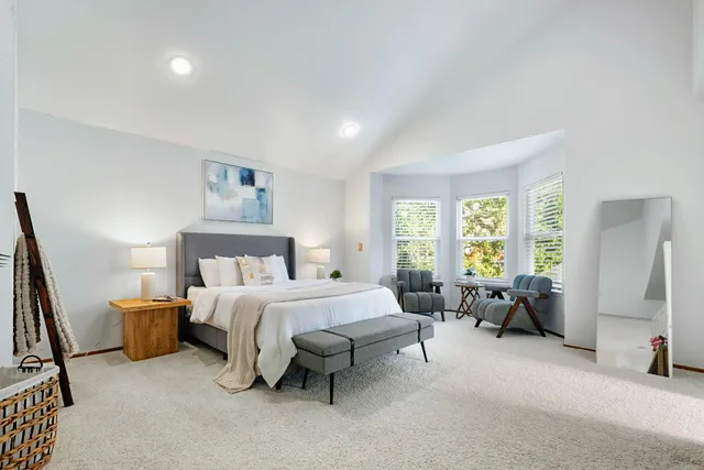 a bed room with a bed and furniture