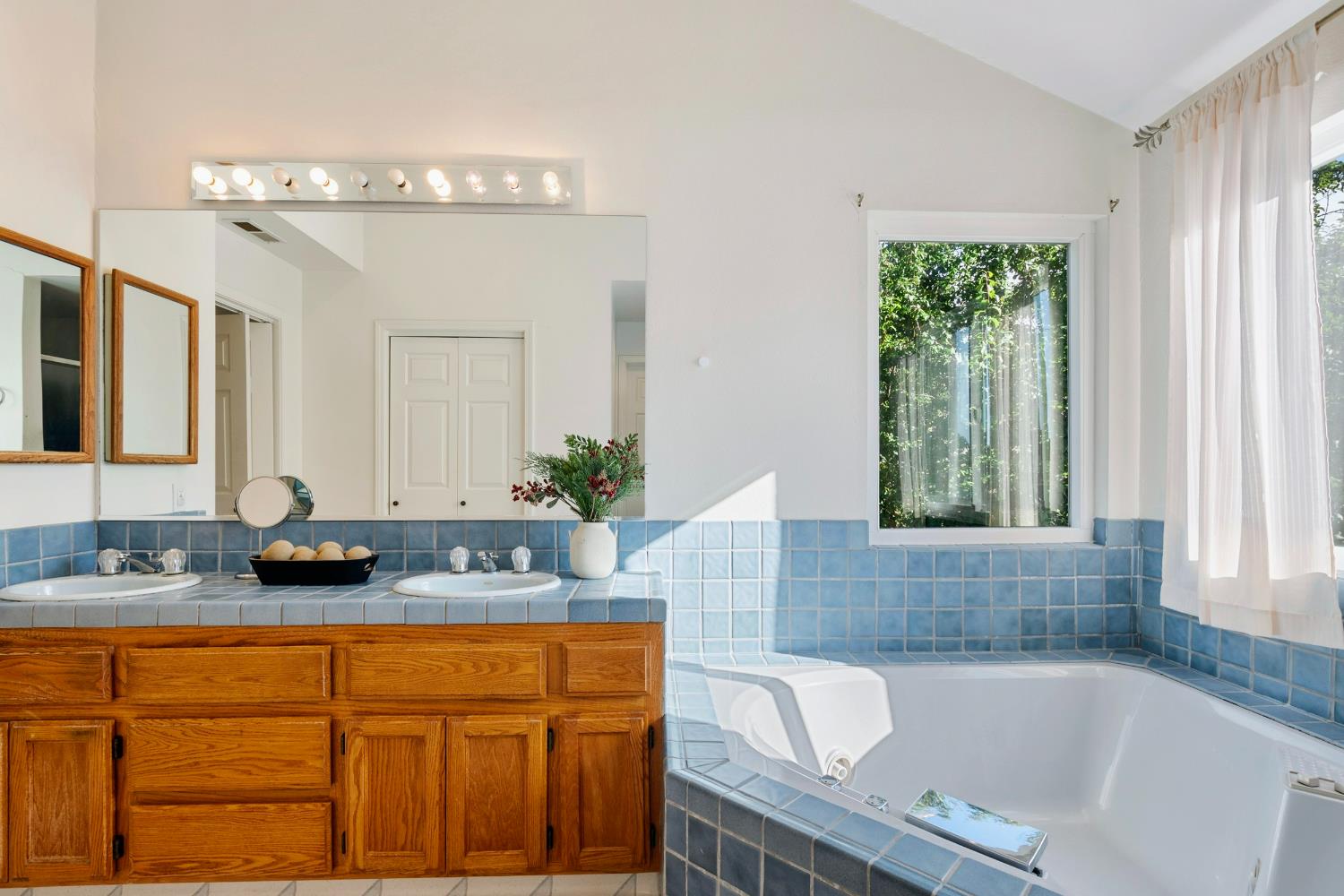 615 Stanley Lane El Sobrante, CA 94803 - Photo 26 of 39 a bathroom with a granite countertop tub sink and mirror