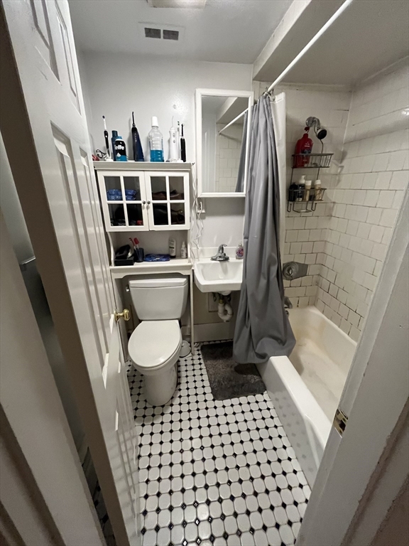 290 Commonwealth Avenue, Unit A Boston, MA 02115 - Photo 11 of 21 a bathroom with a sink a toilet and shower
