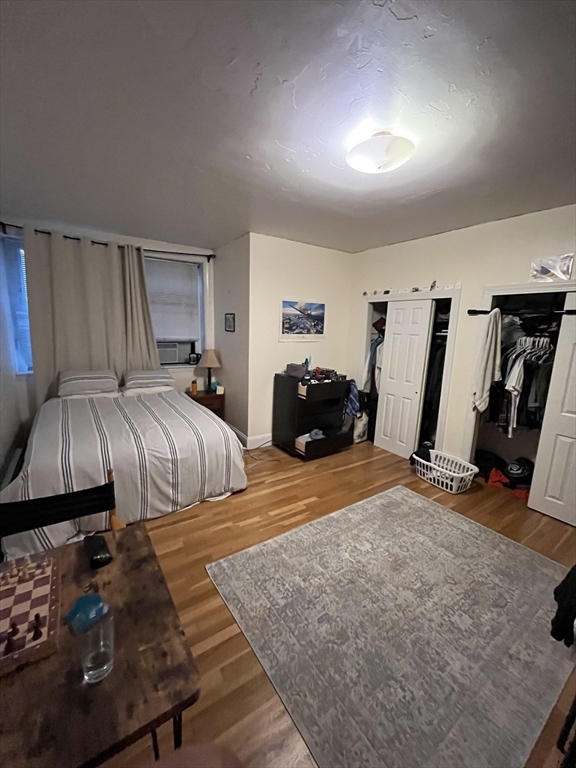 290 Commonwealth Avenue, Unit A Boston, MA 02115 - Photo 16 of 21 a bedroom with a bed and a couch