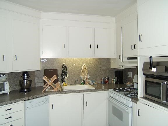 290 Commonwealth Avenue, Unit A Boston, MA 02115 - Photo 2 of 21 a kitchen with stainless steel appliances granite countertop a sink a stove and cabinets