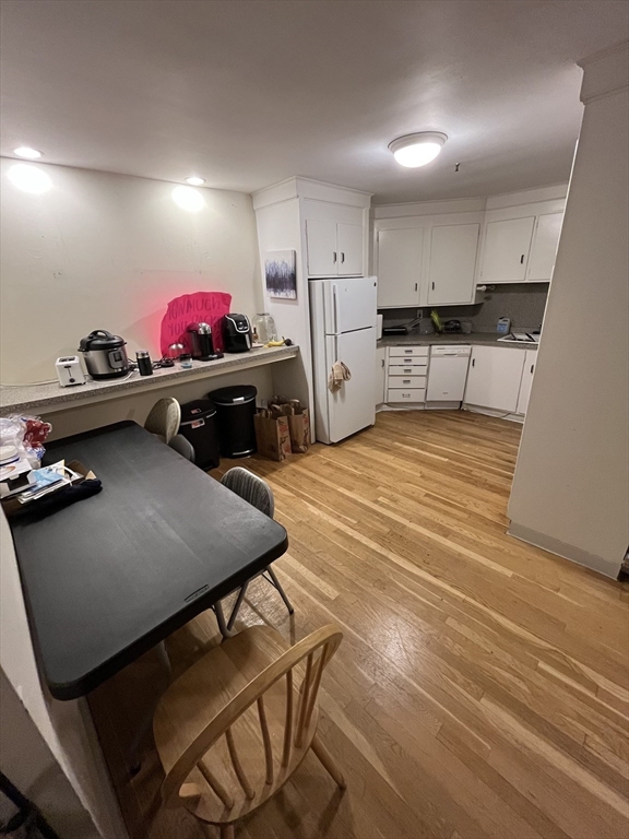 290 Commonwealth Avenue, Unit A Boston, MA 02115 - Photo 4 of 21 a kitchen with stainless steel appliances granite countertop a stove refrigerator and a sink