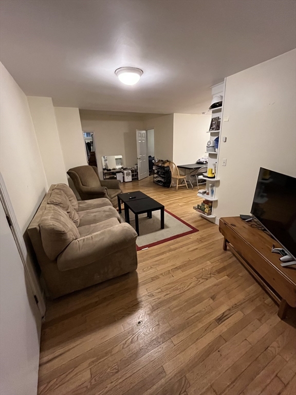 290 Commonwealth Avenue, Unit A Boston, MA 02115 - Photo 6 of 21 a living room with furniture and wooden floor