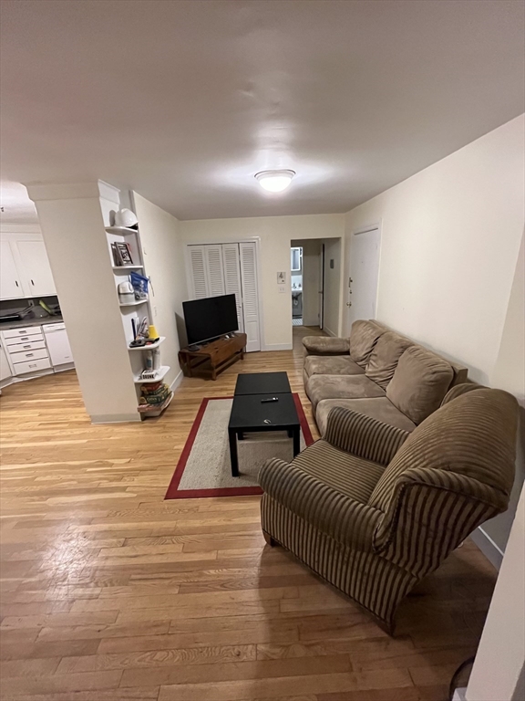 290 Commonwealth Avenue, Unit A Boston, MA 02115 - Photo 7 of 21 a living room with furniture and a flat screen tv