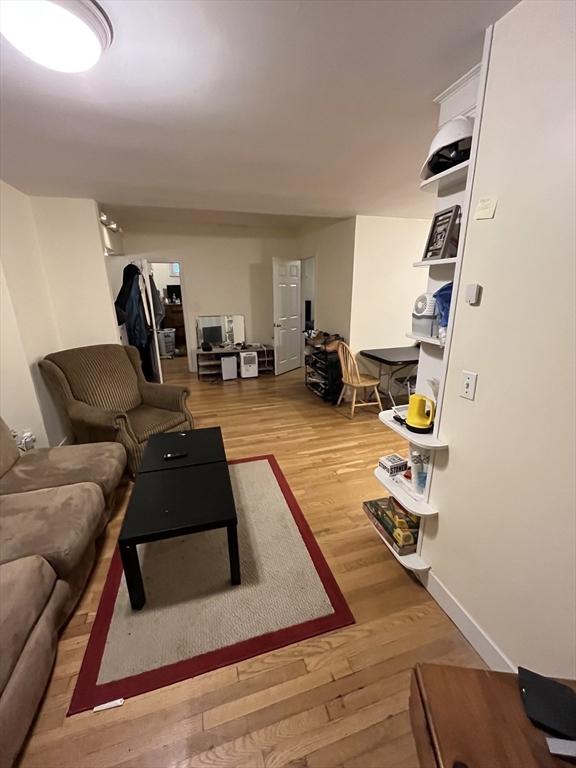 290 Commonwealth Avenue, Unit A Boston, MA 02115 - Photo 8 of 21 a living room with furniture and a flat screen tv