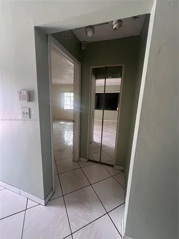 a view of an empty room and window