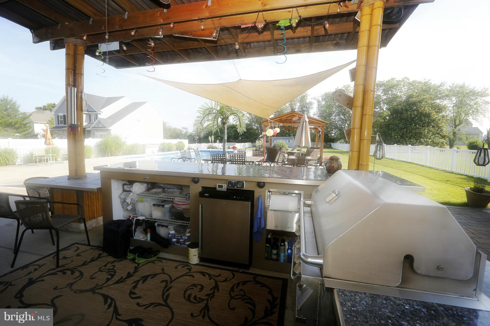 4609 Forge Road Perry Hall, MD 21128 - Photo 4 of 30 a view of a patio with a table chairs and a floor to ceiling window