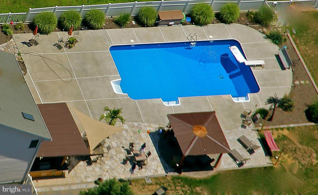 4609 Forge Road Perry Hall, MD 21128 - Photo 7 of 30 an aerial view of a house with a swimming pool