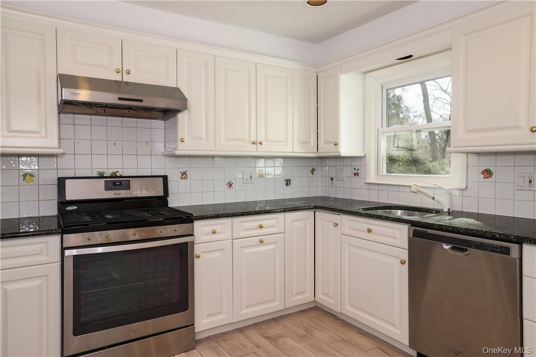 65 Lincoln Road Scarsdale, NY 10583 - Photo 8 of 29 Kitchen with wood cabinetry